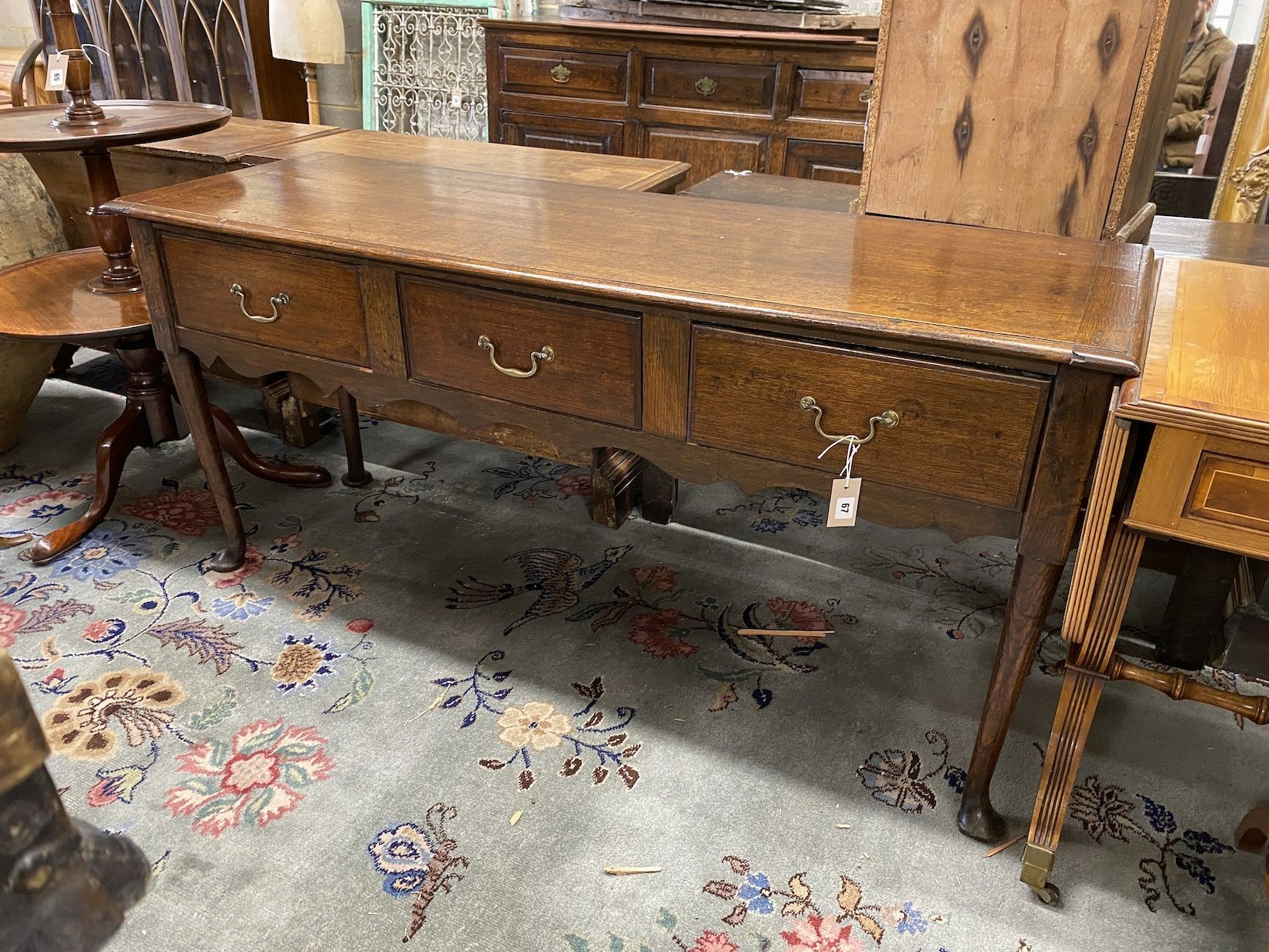 An 18th century and later oak low dresser, length 154cm, depth 51cm, height 73cm